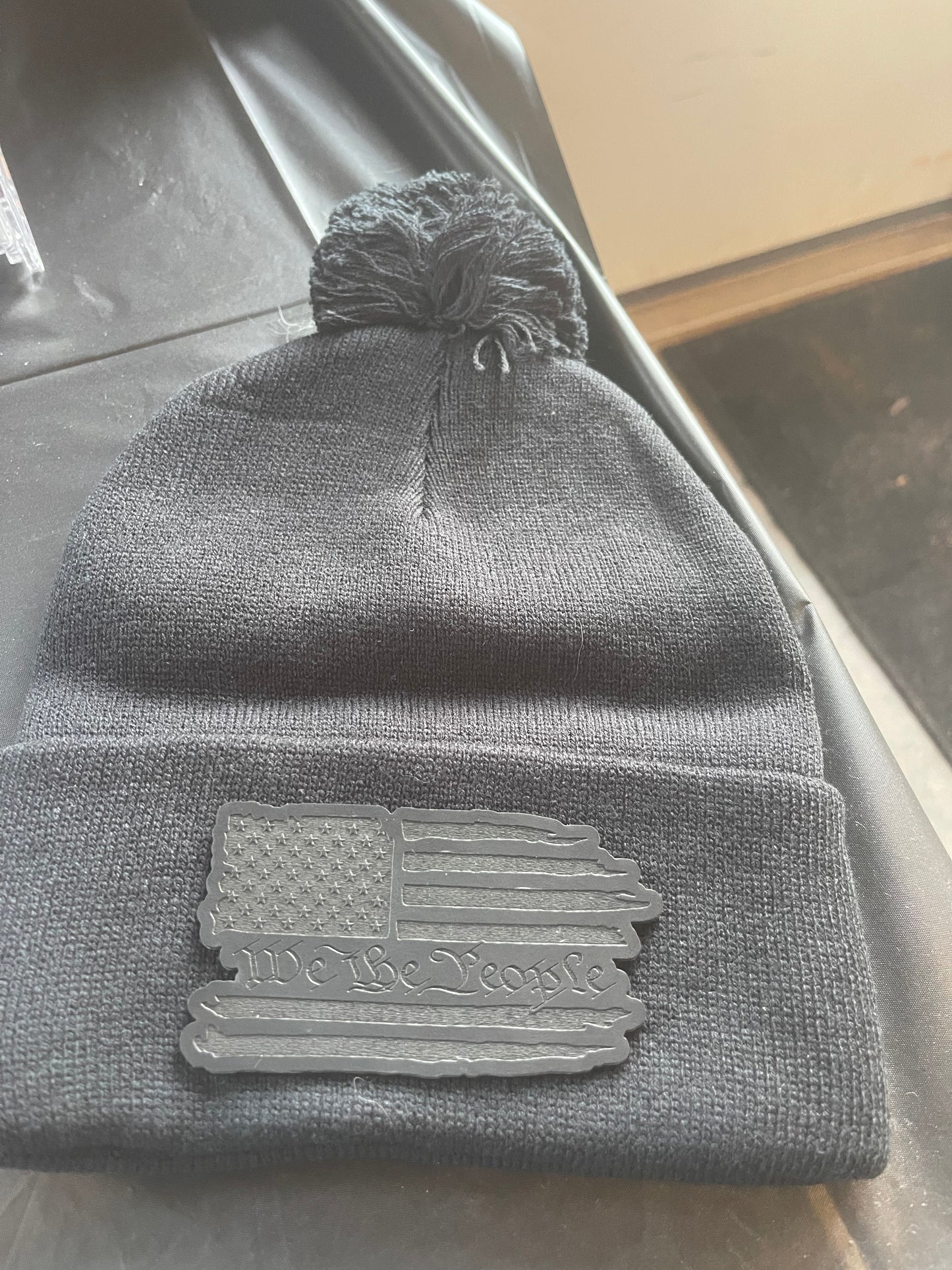 We the People Cuff PomPom Beanie